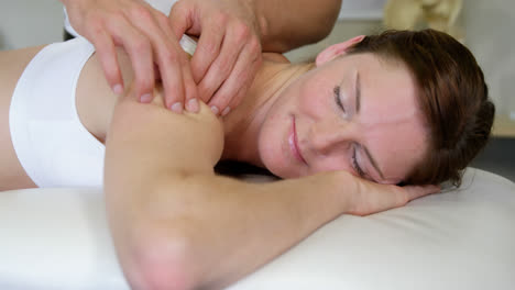 Male-physiotherapist-giving-arm-massage-to-female-patient
