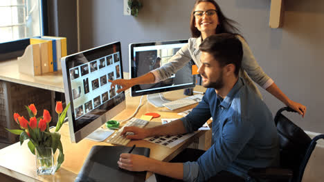 Male-and-female-graphic-designer-working-on-computer