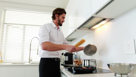 Man-preparing-a-food-in-kitchen