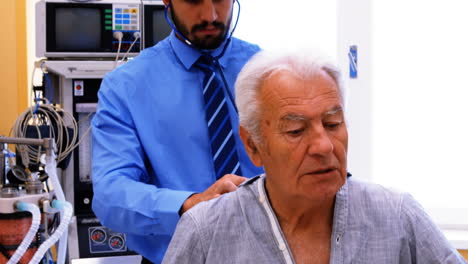 Male-doctor-examining-a-patient