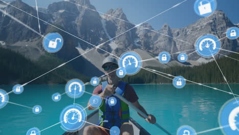 Animation-of-network-of-connections-with-icons-over-caucasian-man-in-boat-on-lake-in-mountains