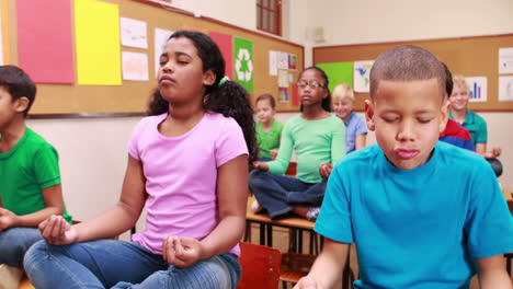 Pupils-doing-yoga-in-classroom