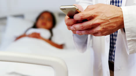 Doctor-using-mobile-phone-in-hospital