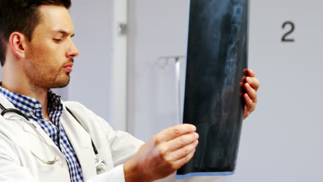 Doctor-examining-x-ray-report