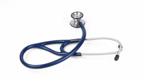 High-angle-of-a-stethoscope-spinning-against-white