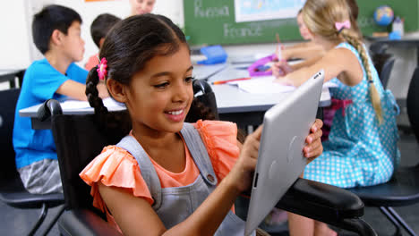 Disabled-schoolgirl-using-digital-tablet