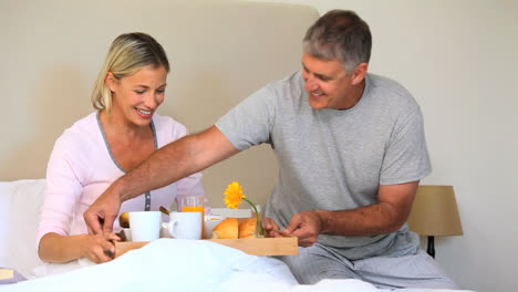 Man-bringing-his-wife-breakfast-in-bed