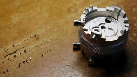 Close-up-of-clock-repairing-tool-and-screws