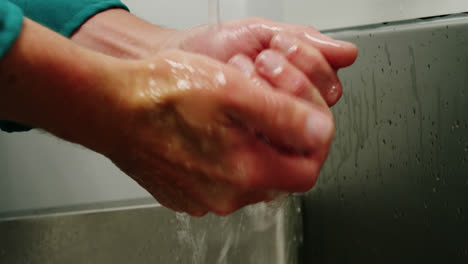 Close-up-of-surgeons-washing-his-hands