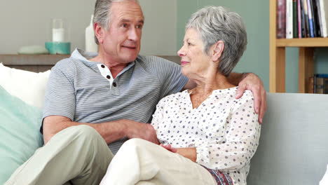 Senior-couple-sitting-and-talking