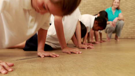 Pupils-doing-push-ups-during-sport-lesson