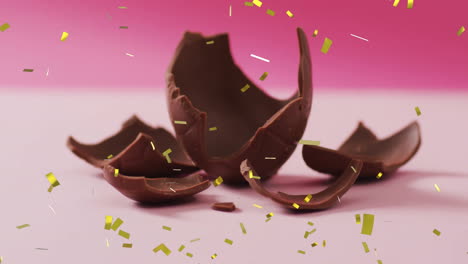 Animation-Von-Konfetti,-Das-über-Schokolade-Auf-Rosa-Hintergrund-Fällt