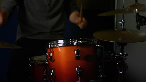 Man-playing-a-drums