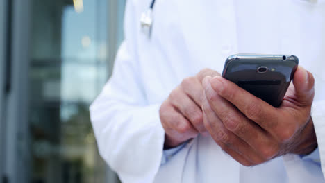 Doctor-using-mobile-phone-in-hospital
