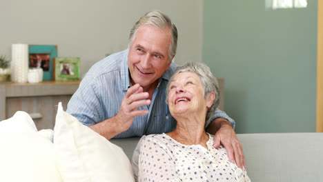 Senior-couple-embracing-in-living-room