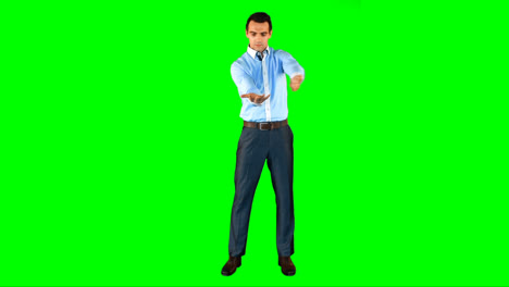 Man-gesturing-against-green-background