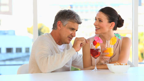 Middle-aged-couple-drinking-cocktails