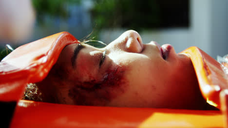 Paramedics-examining-injured-girl