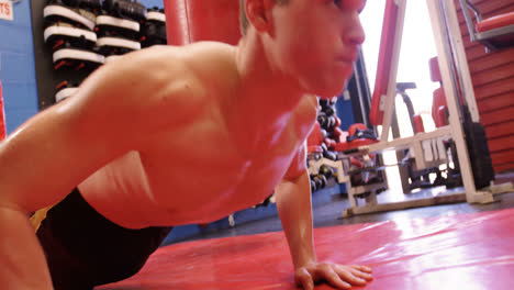 Shirtless-boxer-performing-push-ups