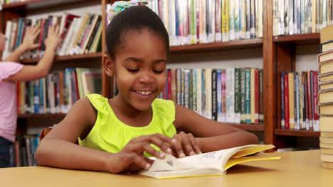 Smiling-little-girl-reading-a-book