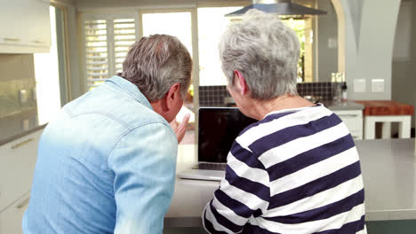 Senior-couple-using-a-laptop