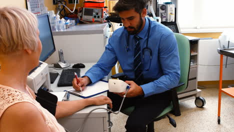 Doctor-checking-blood-pressure-of-patient