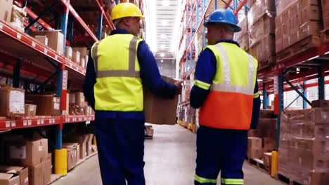 Two-warehouse-workers-interacting-with-each-other