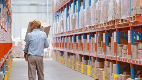 Warehouse-worker-holding-packages