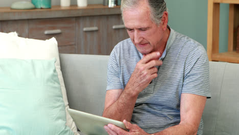 Senior-man-using-tablet-pc