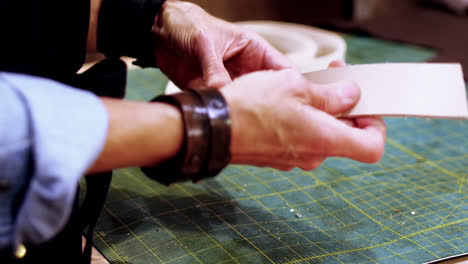Craftswoman-making-leather-belt