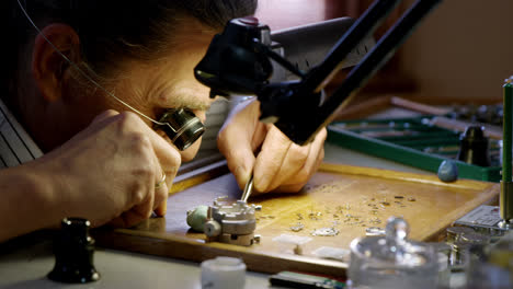 Close-up-of-horologist-repairing-a-watch