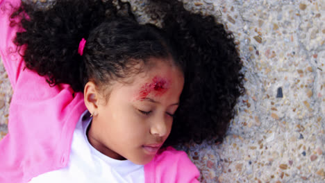 Unconscious-girl-fallen-on-ground-after-accident