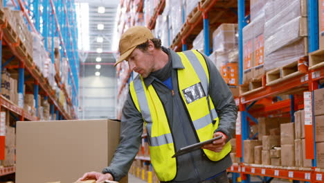 Warehouse-worker-looking-at-packages