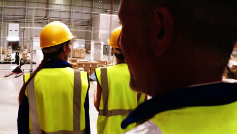 Group-of-warehouse-workers-walking-together