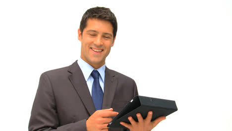 Businessman-checking-his-touch-pad-against-a-white-background