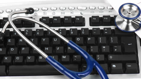 Panorama-of-a-stethoscope-on-a-keyboard-with-electrogram