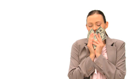 Joyful-businesswoman-counting-her-money-against-a-white-background