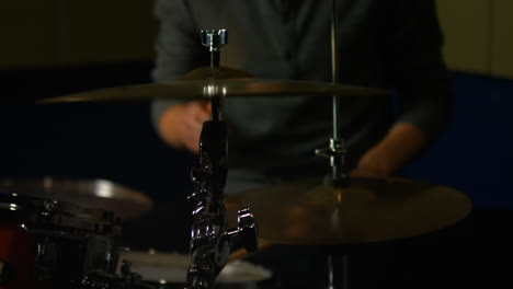 Man-playing-a-drums