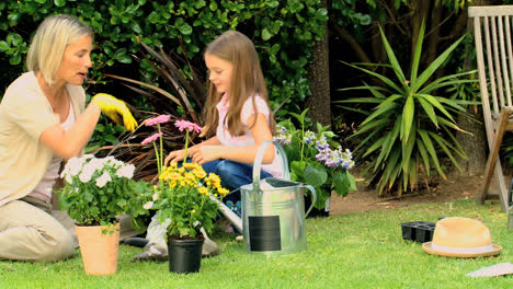 Mother-with-her-daughter-doing-some-gardening