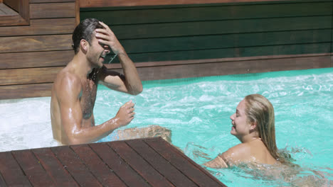 Couple-having-fun-together-in-swimming-pool