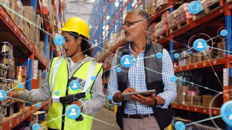 Animation-of-network-of-connections-with-icons-over-diverse-female-and-male-workers-in-warehouse