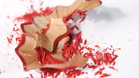 Red-color-pencils-shavings-on-a-white-background