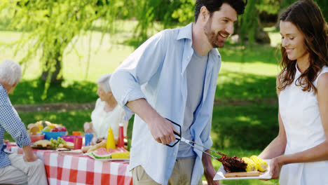 Couple-preparing-food-on-barbecue