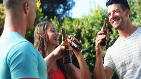 Group-of-friends-toasting-beer-bottles