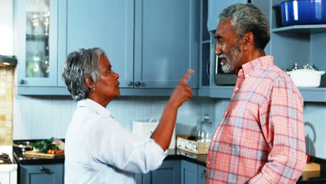 Senior-couple-quarrelling-with-each-other-in-kitchen