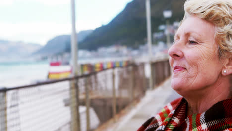 Senior-woman-enjoying-the-view-at-the-beach