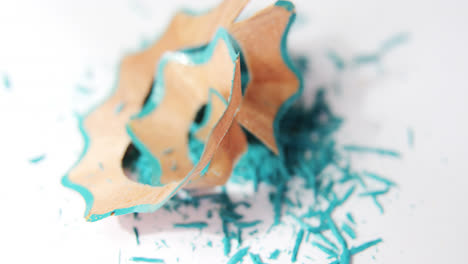 Turquoise-color-pencils-shavings-on-a-white-background