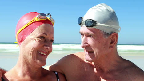 Senior-couple-interacting-with-each-other-at-the-beach