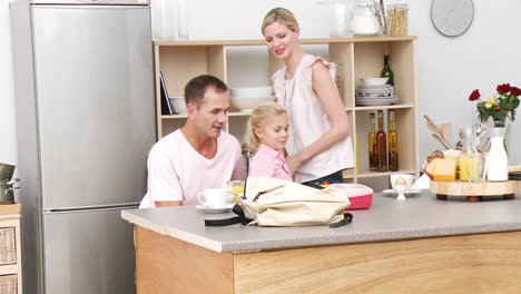 Parents-and-daughter-in-the-kitchen-after-school