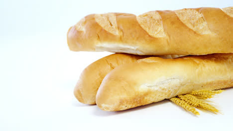 Baguettes-with-wheat-on-white-background